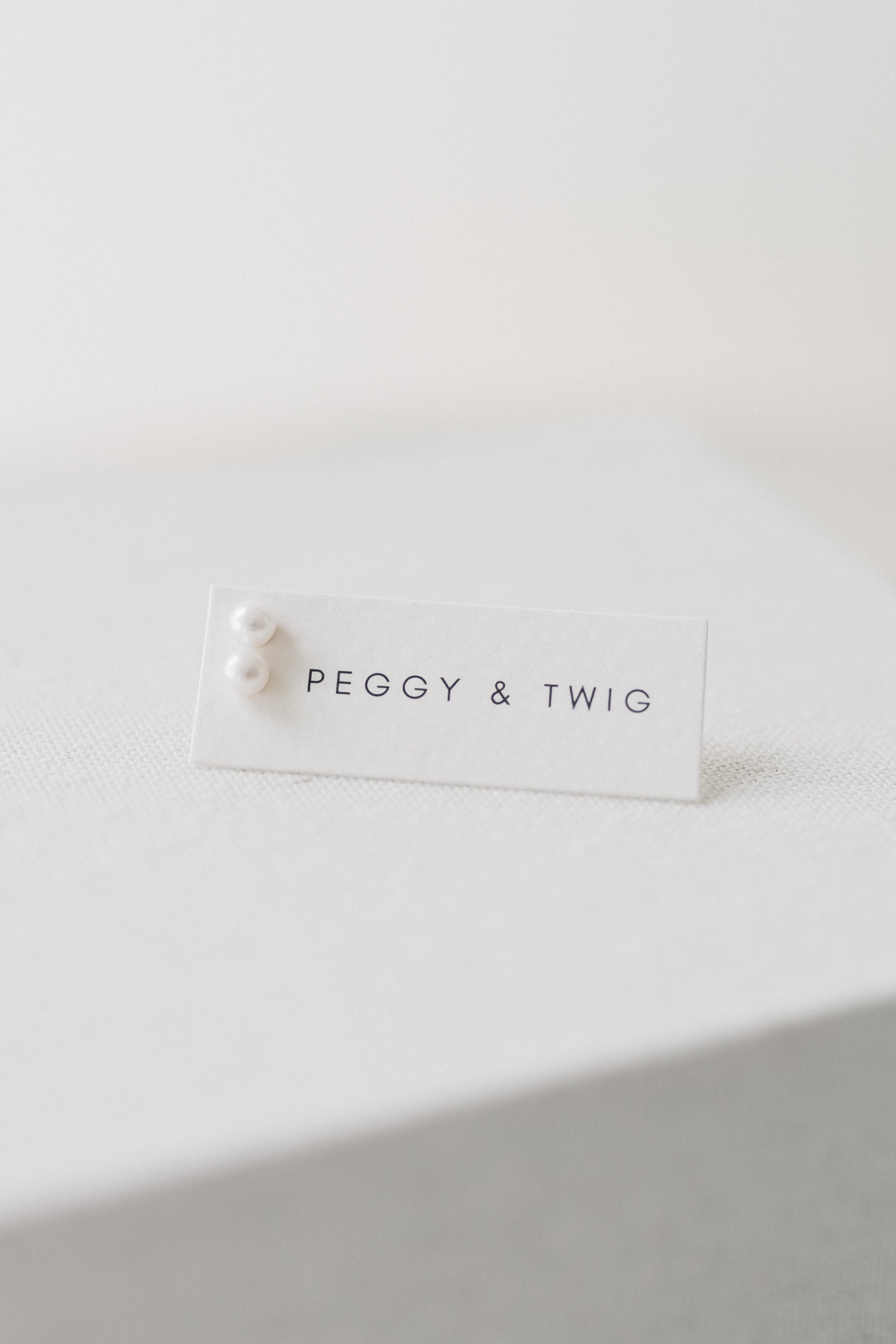 TINY PEARL STUDS