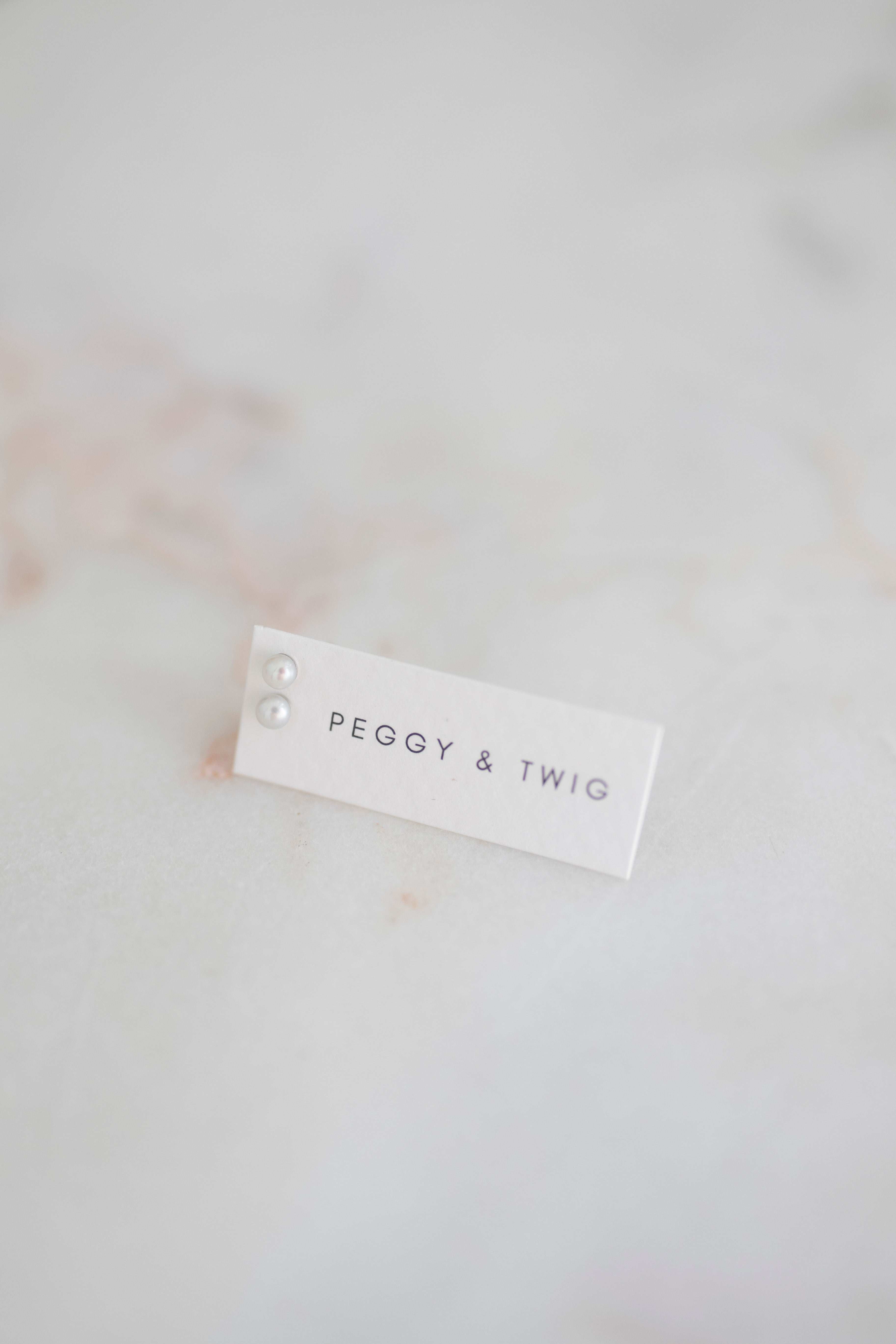 TINY PEARL STUDS